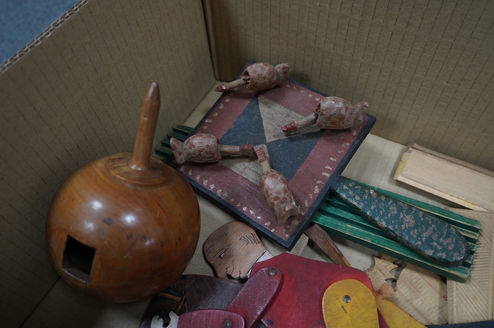 A collection of 19th century toys including; an early Jaques Ping Pong or Gossima set in an illustrated wooden case, a Crandall’s John Gilpin wooden horse with folded linen backed poster, ‘The Adventures of John Gilpin’
